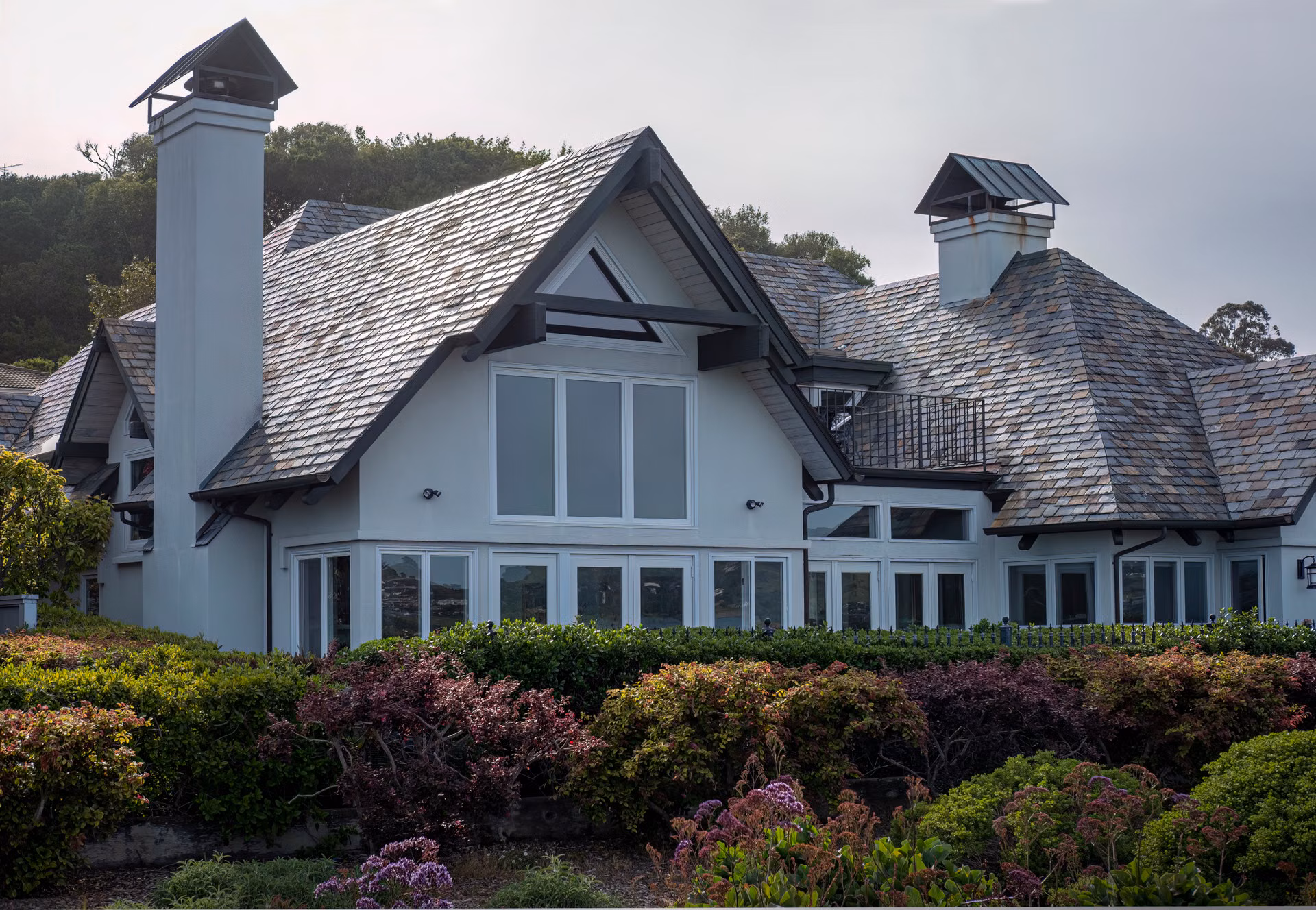 Large home with a gray architectural shingle roof